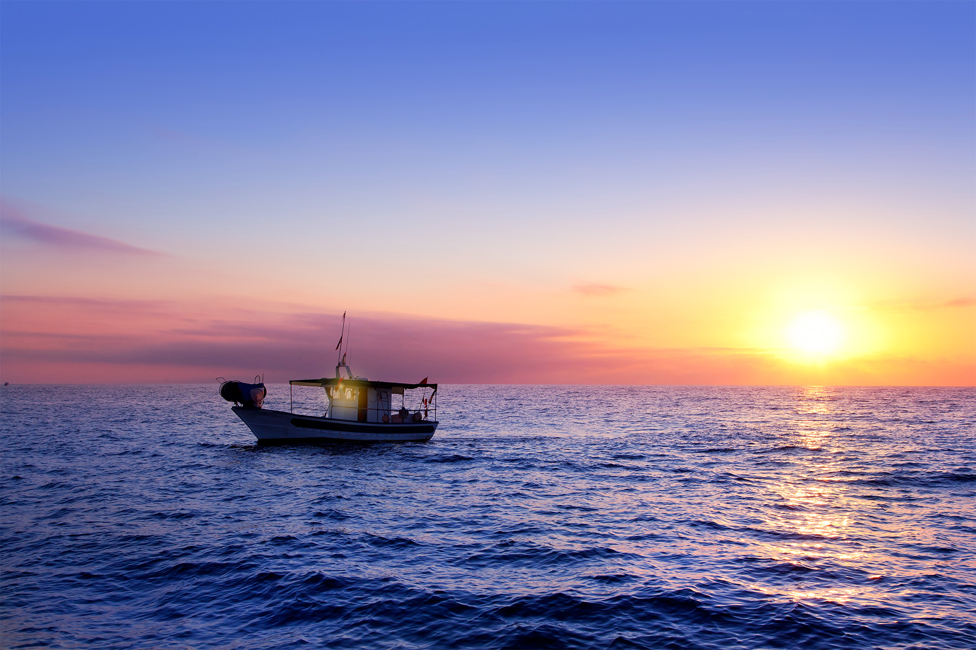 Spanish fishing boat at sea during a sunset|Food Related|San Antonio TX